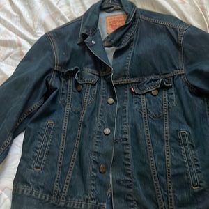 This is a dark blue Levi jean jacket size small